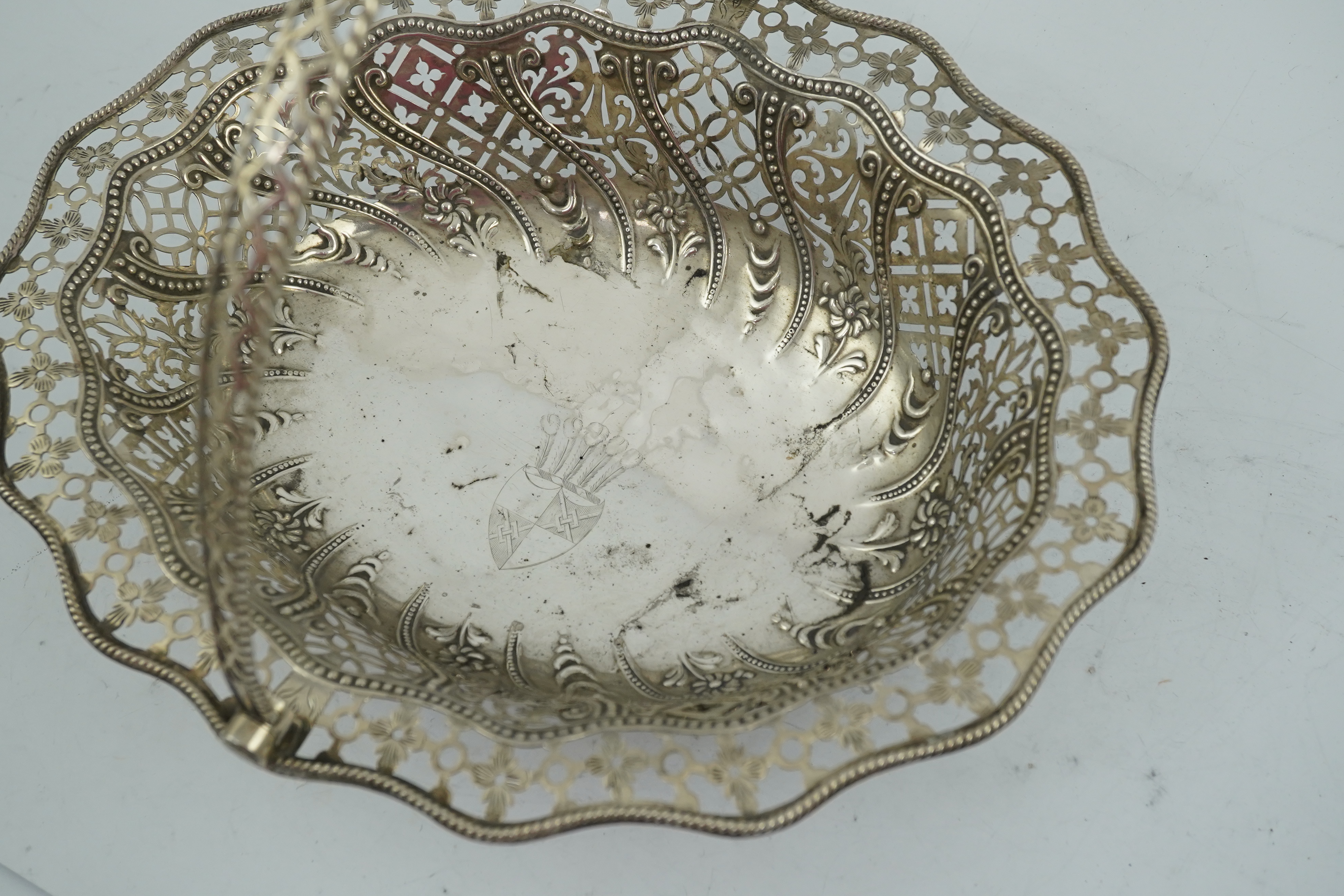 A George III pierced repousse silver cake basket